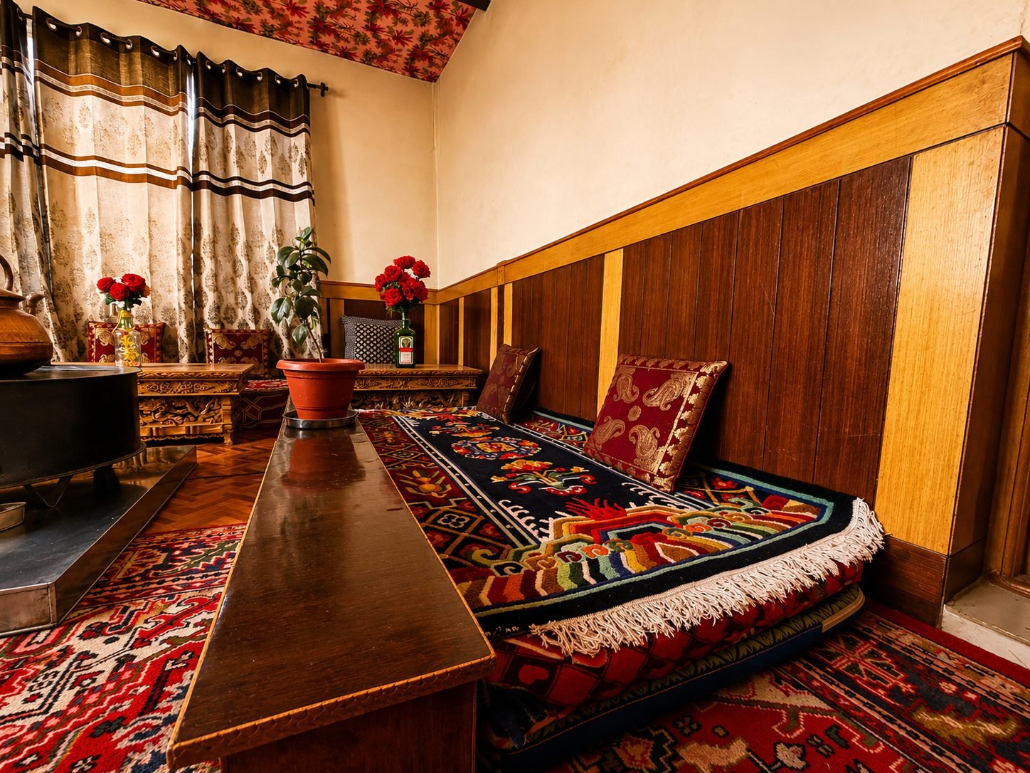 Low-seating lounge area with bukhari stove at 7 Pines Homestay